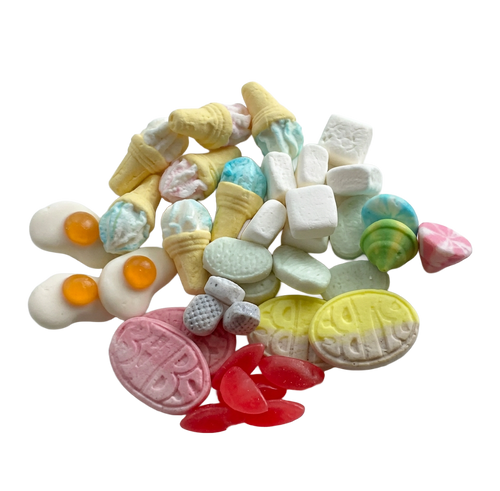 A pile of gelatin free Swedish candy assorted miniatures and confection pieces, including ice cream cone shapes, egg-shaped pieces with orange yolks, pastel marshmallows, marbled candies, and yellow and pink embossed pieces, isolated on a white background.