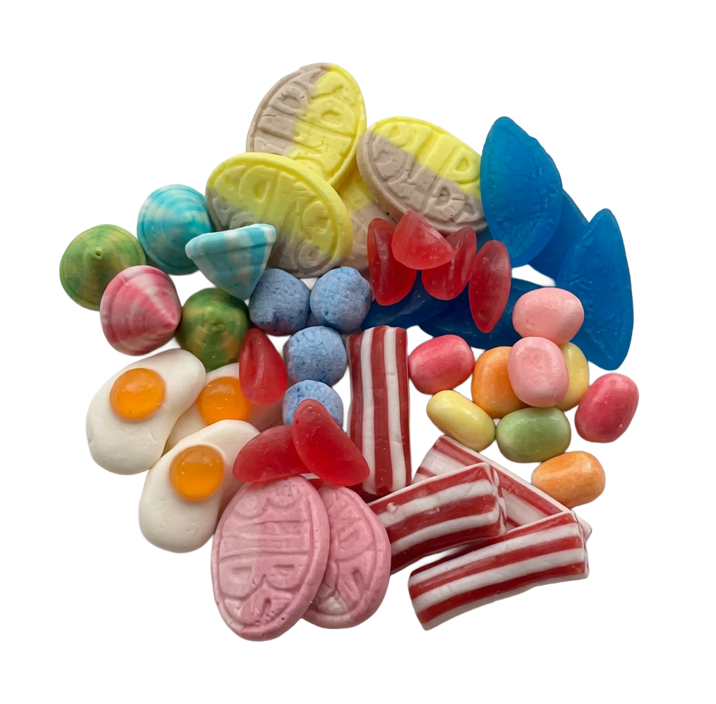 A colorful assortment of Swedish gummy and hard candies piled together on a plain white background, including pink striped pieces, red translucent gummies, blue pieces, yellow pieces, green and orange pieces, and egg-shaped white candies with orange yolks.