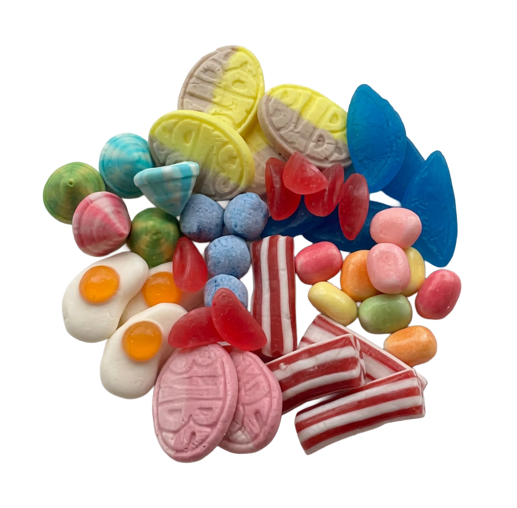 A colorful assortment of Swedish gummy and hard candies piled together on a plain white background, including pink striped pieces, red translucent gummies, blue pieces, yellow pieces, green and orange pieces, and egg-shaped white candies with orange yolks.