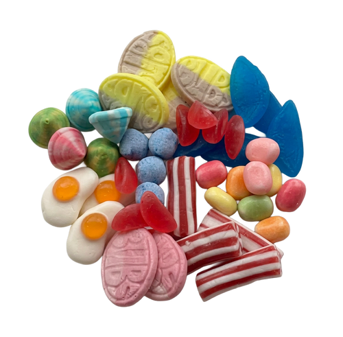 A colorful assortment of Swedish gummy and hard candies piled together on a plain white background, including pink striped pieces, red translucent gummies, blue pieces, yellow pieces, green and orange pieces, and egg-shaped white candies with orange yolks.